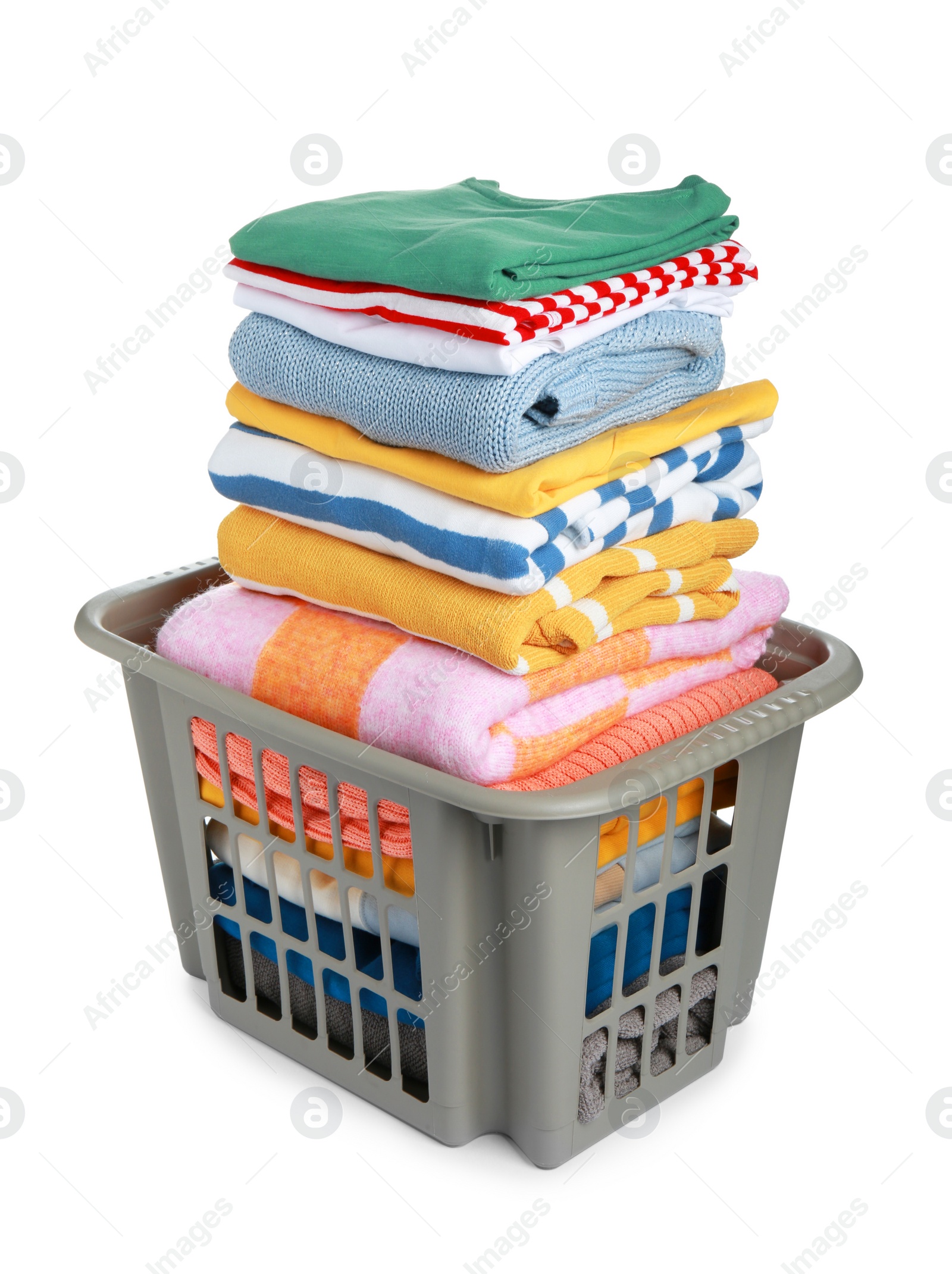 Photo of Plastic laundry basket with clean clothes isolated on white