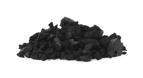 Photo of Pile of crushed activated charcoal pills on white background. Potent sorbent