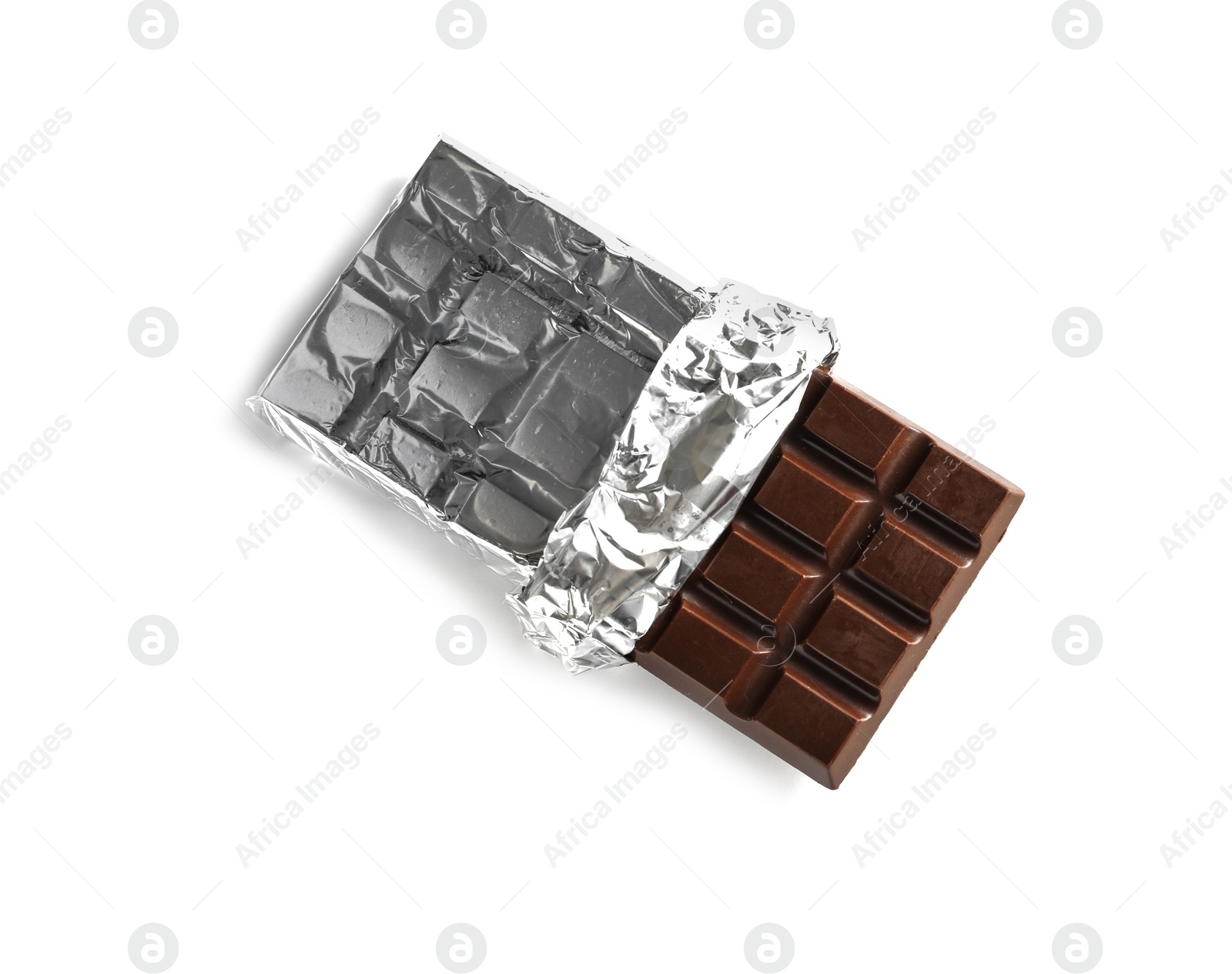 Photo of Tasty dark chocolate bar with foil on white background, top view