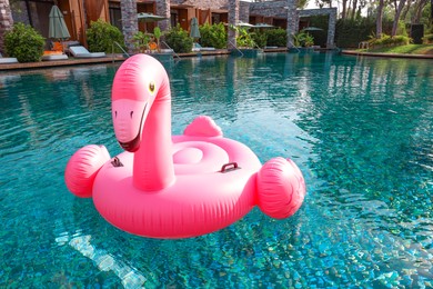 Photo of Float in shape of flamingo in swimming pool at luxury resort