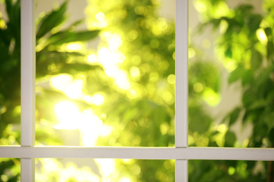 Photo of Beautiful view through window on garden in morning