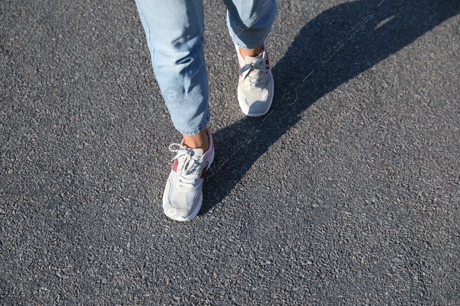 Photo of Woman walking outdoors, closeup with space for text. Choosing way concept.