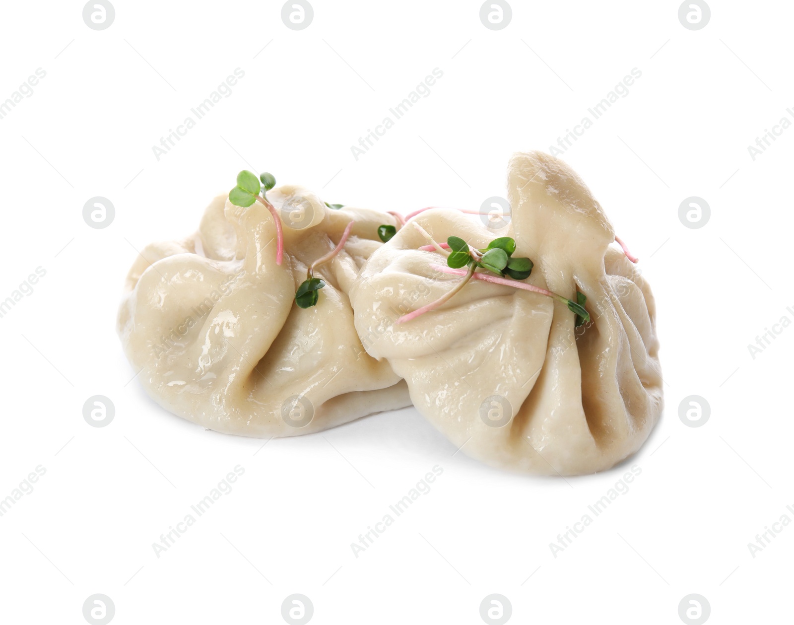 Photo of Tasty baozi dumplings with sprouts on white background