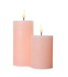 Pink candles with wicks isolated on white