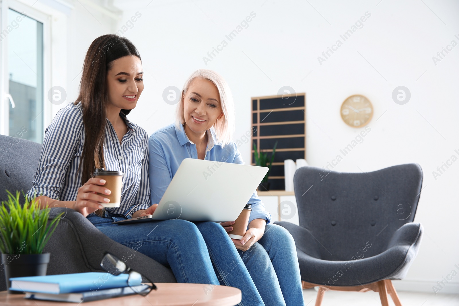 Photo of Business people working on laptop in office, space for text. Professional communication