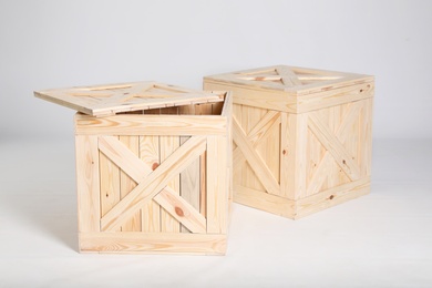 Photo of Pair of wooden crates on grey background