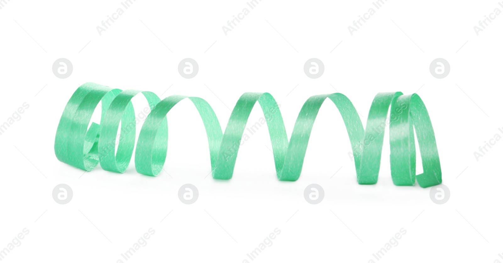 Photo of Green serpentine streamer isolated on white. Party element