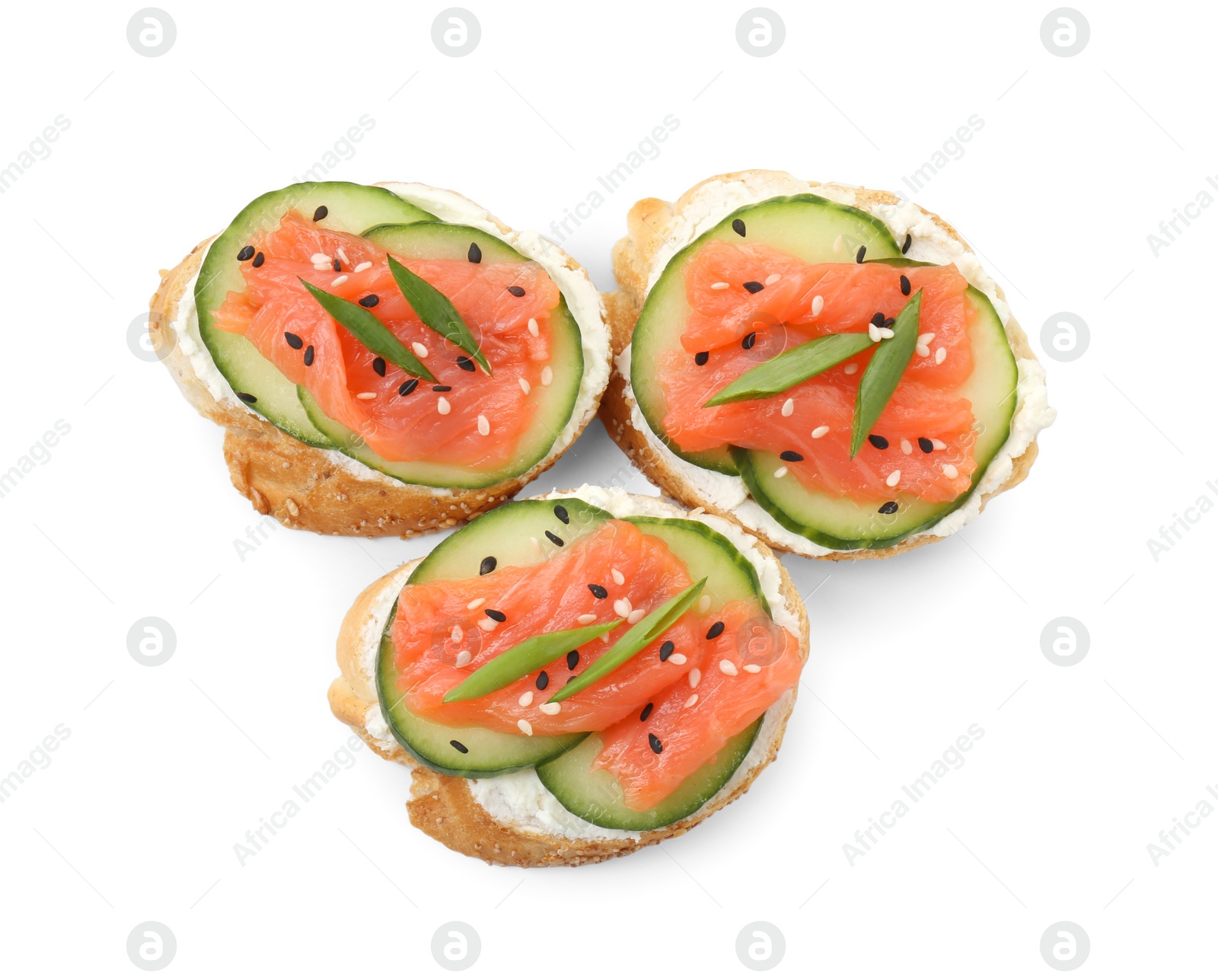 Photo of Tasty canapes with salmon, cucumber and cream cheese isolated on white, top view