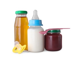 Healthy baby food, bottles with juice, milk and pacifier on light grey background