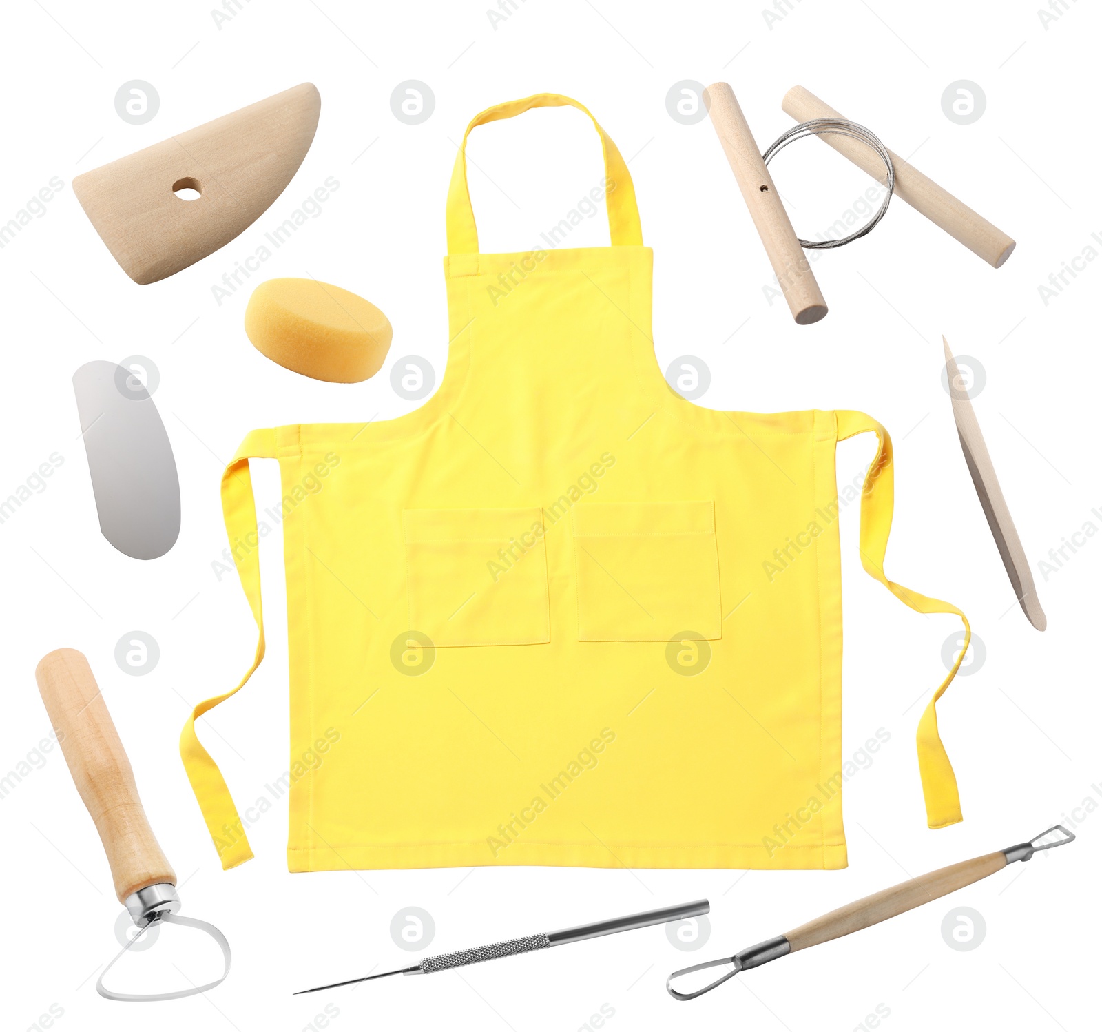 Image of Set of pottery tools and yellow apron on white background