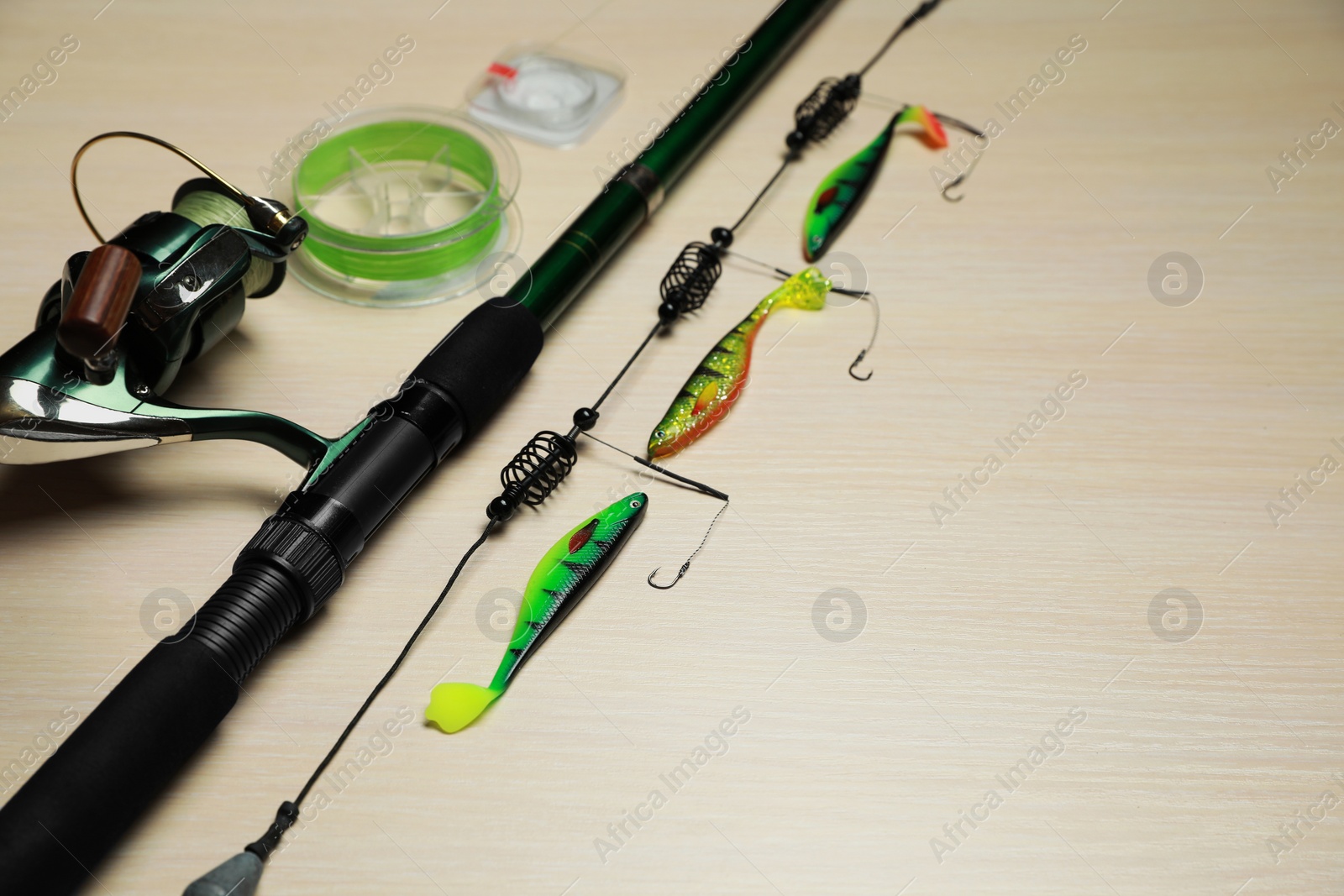 Photo of Fishing tackle on wooden background. Space for text