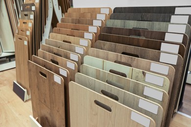 Photo of Many different samples of wooden flooring in store