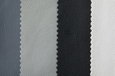 Photo of Leather samples of different colors for design as background, closeup