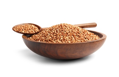 Photo of Bowl and spoon with uncooked buckwheat on white background