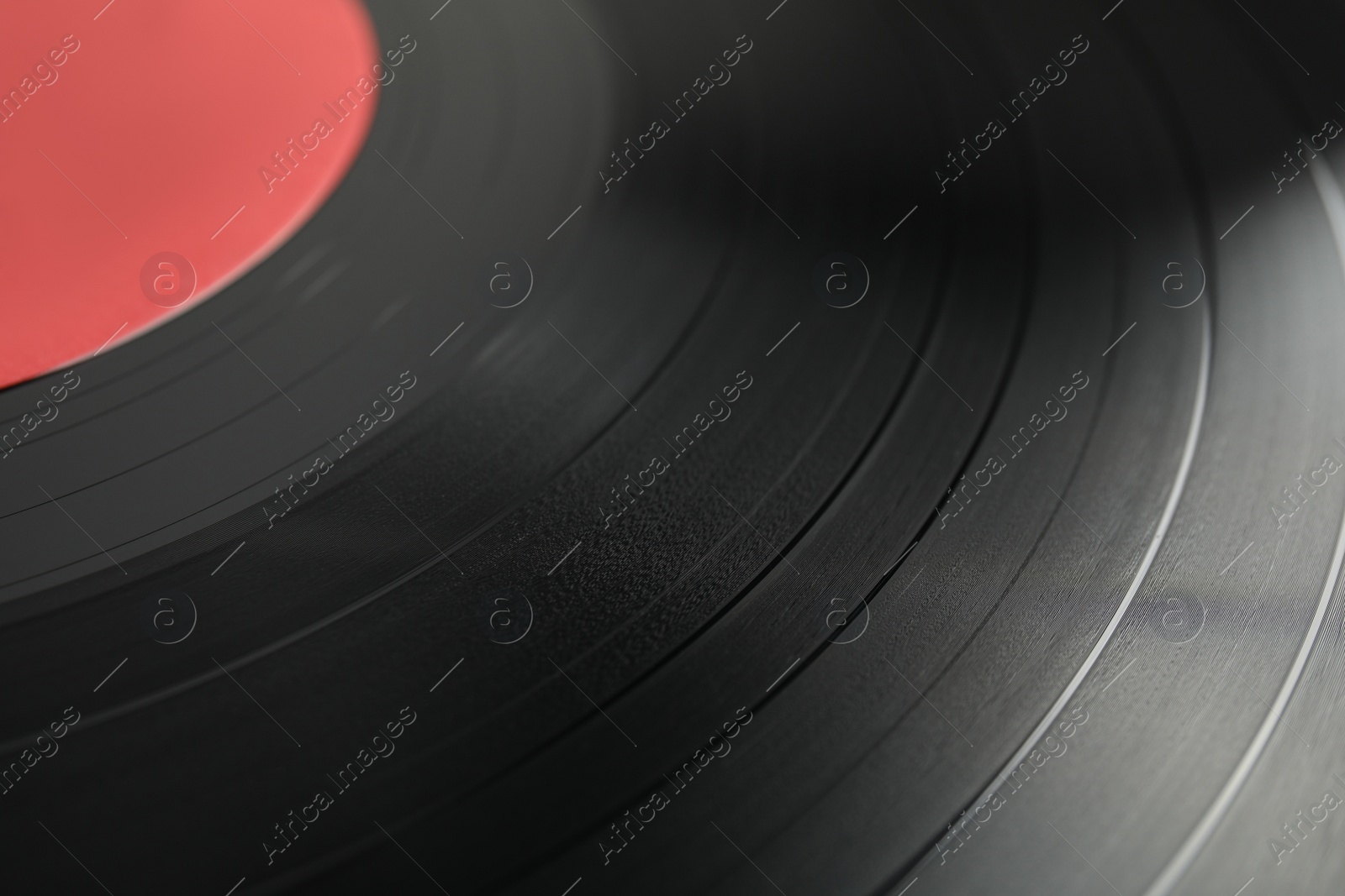 Photo of Closeup view of vintage vinyl record as background