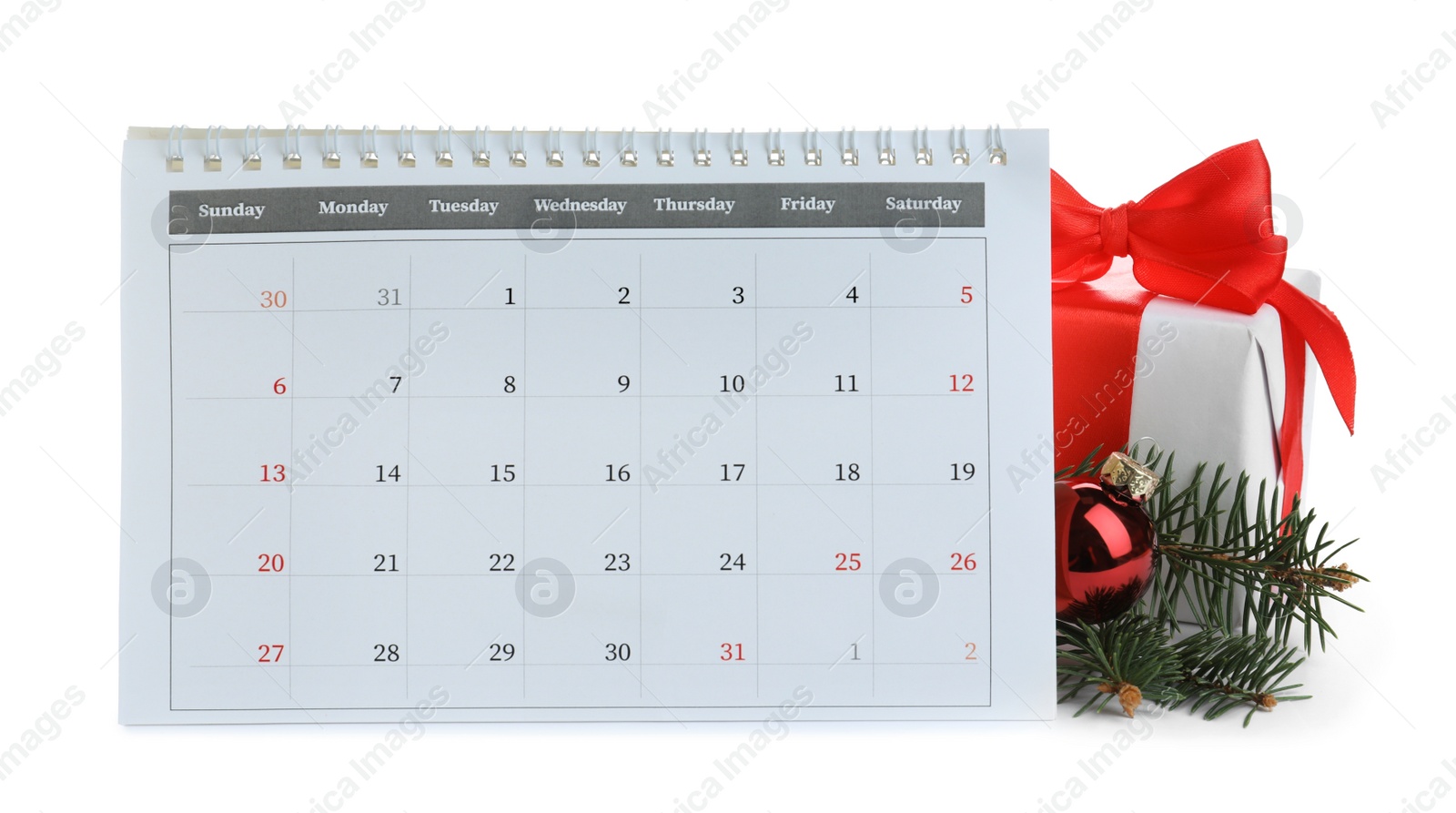 Photo of Flip calendar, gift and decor on white background. Christmas countdown