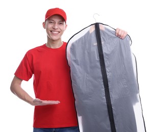 Dry-cleaning delivery. Happy courier holding garment cover with clothes on white background