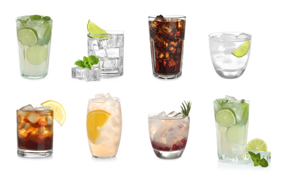 Set of different delicious cocktails with ice cubes on white background