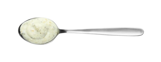 Photo of Spoon with tasty tartar sauce isolated on white, top view