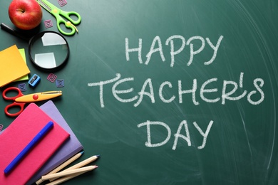 Image of Text Happy Teacher's Day and different school stationery on green chalkboard, flat lay. Greeting card design