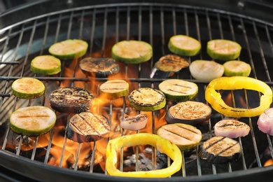 Photo of New modern barbecue grill with different vegetables, closeup