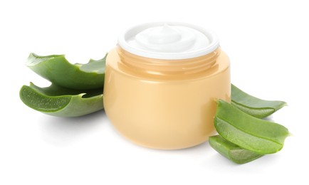 Jar of natural cream and cut aloe leaves isolated on white