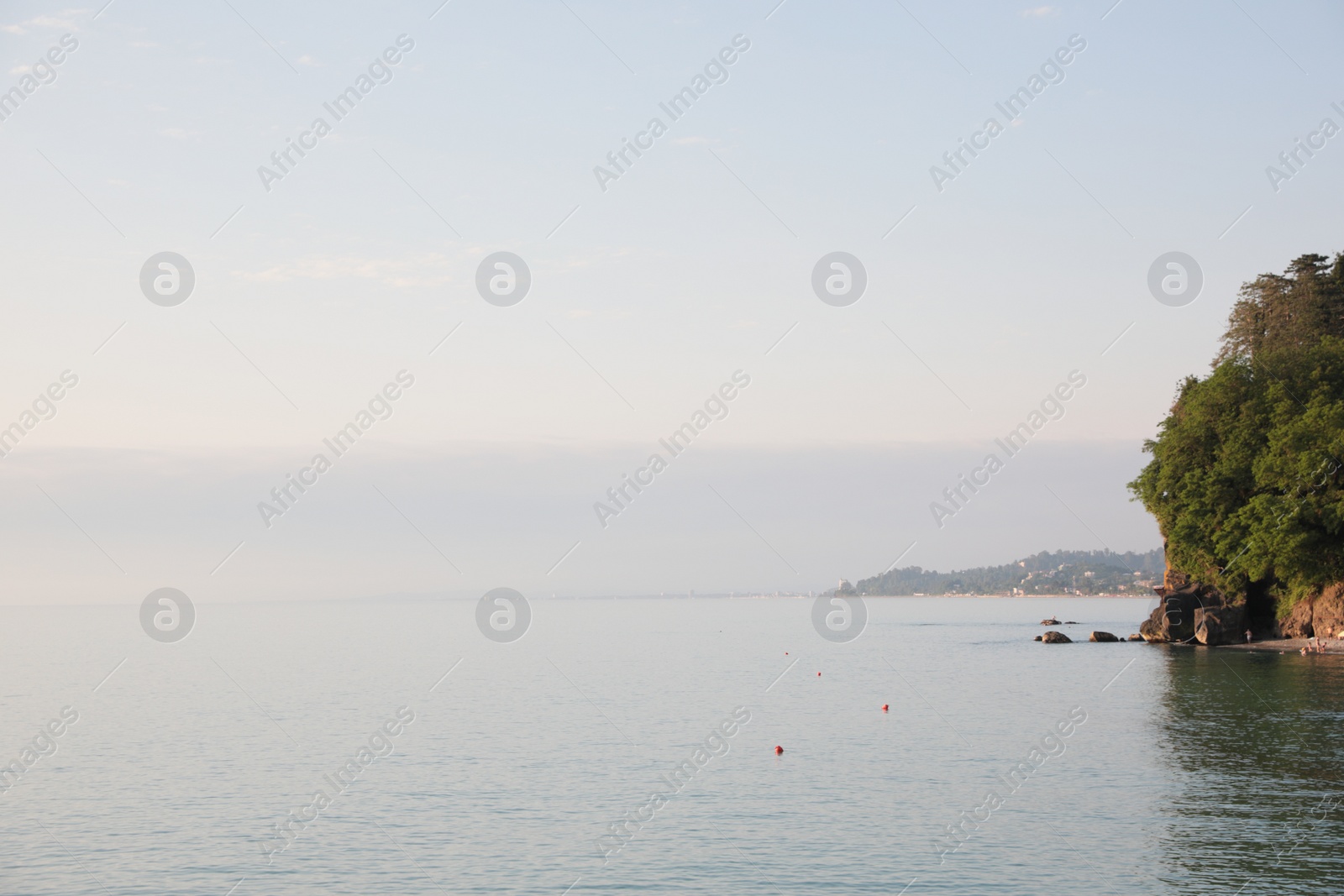 Photo of Picturesque view of sea and city under sky outdoors