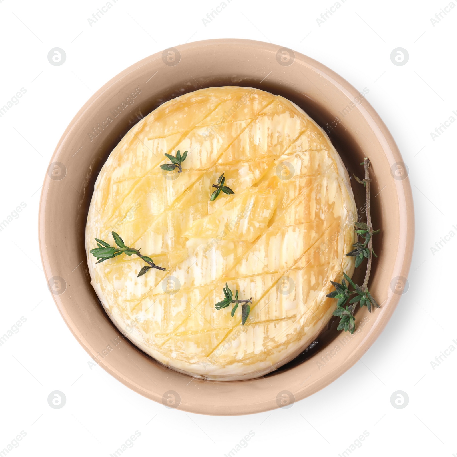 Photo of Tasty baked camembert and thyme in bowl on white background, top view