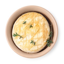 Tasty baked camembert and thyme in bowl on white background, top view