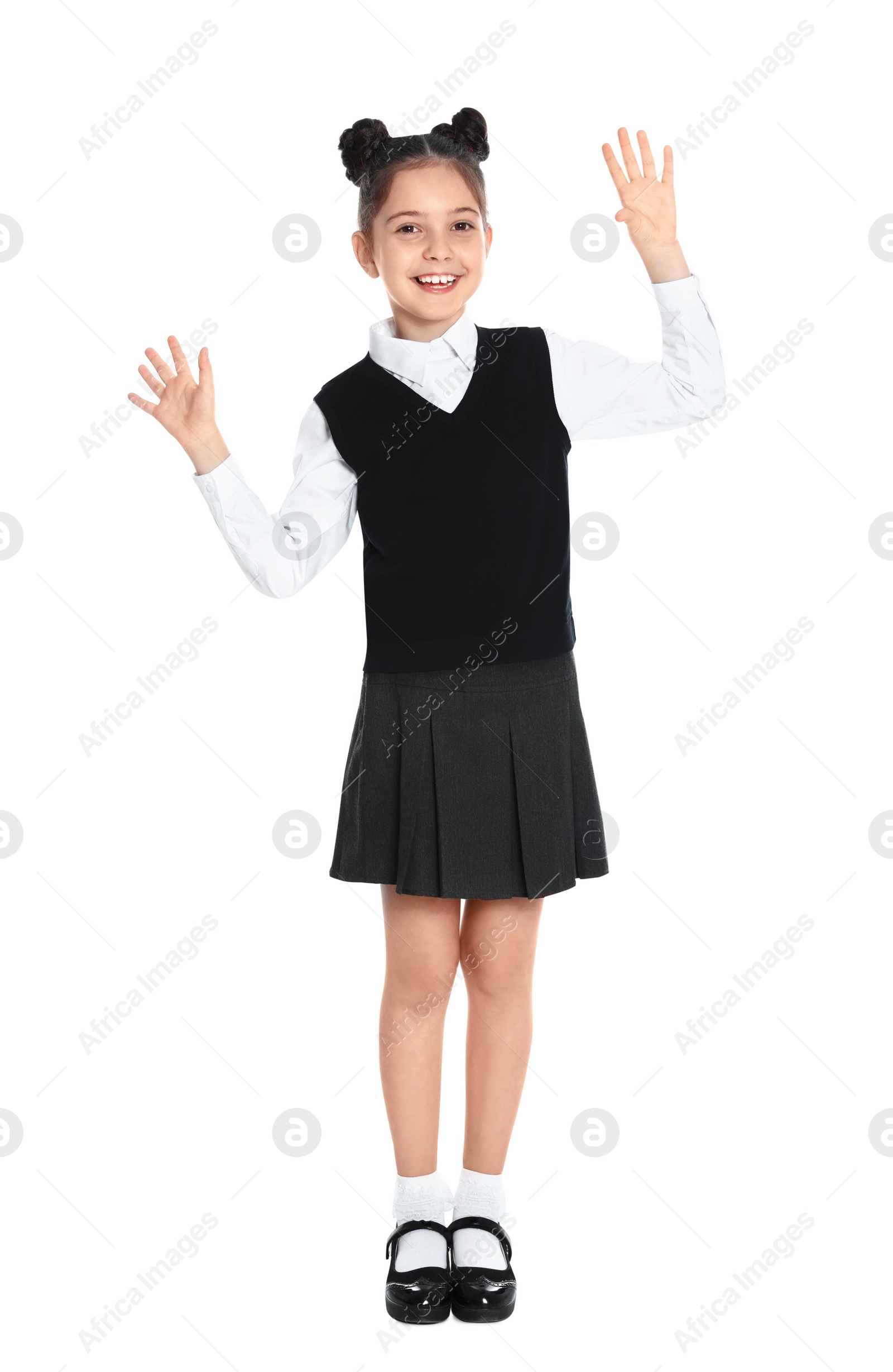 Photo of Happy girl in school uniform on white background