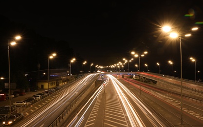 Photo of Night road with illumination in modern city