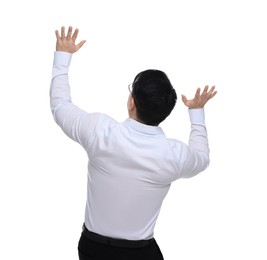 Businessman in formal clothes posing on white background, back view