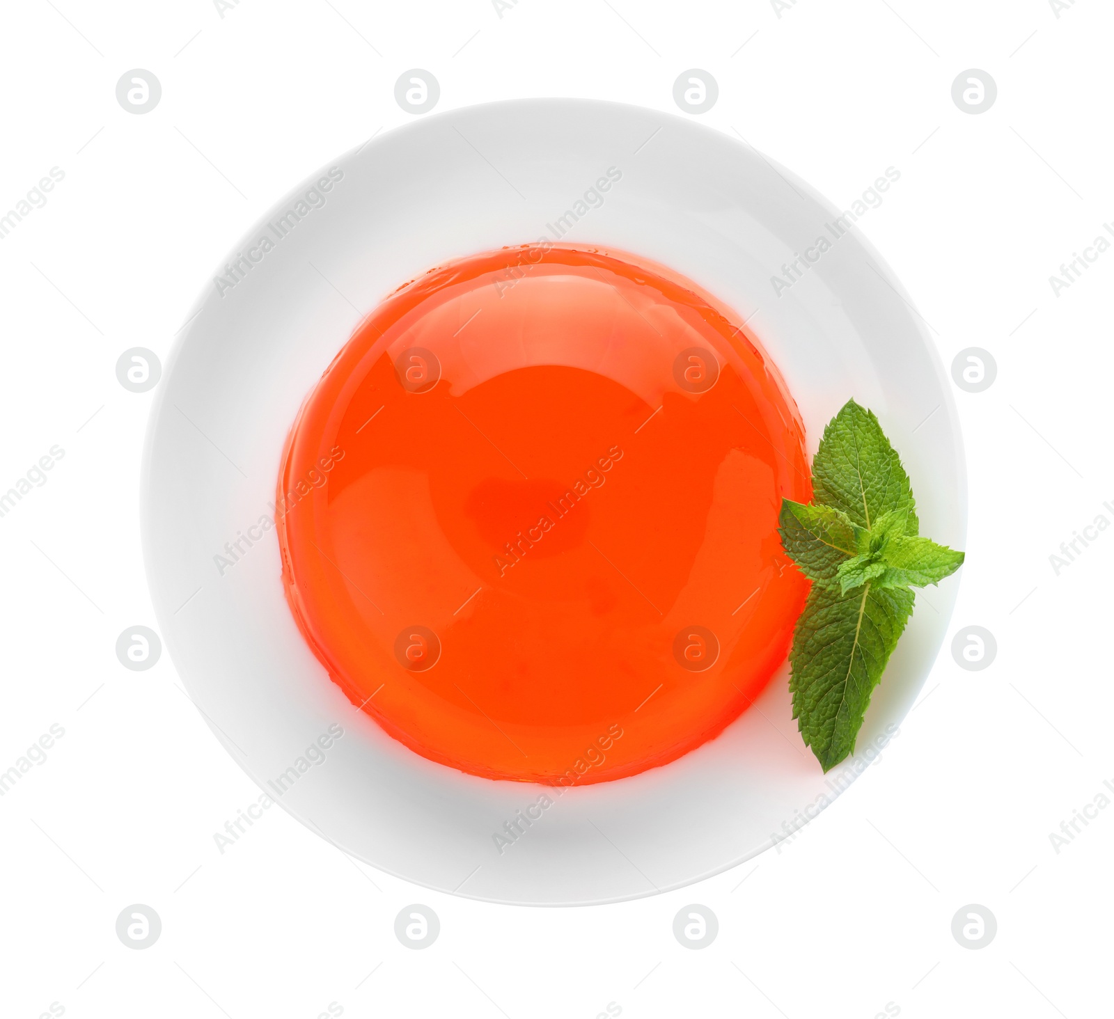 Photo of Delicious orange jelly with mint on white background, top view