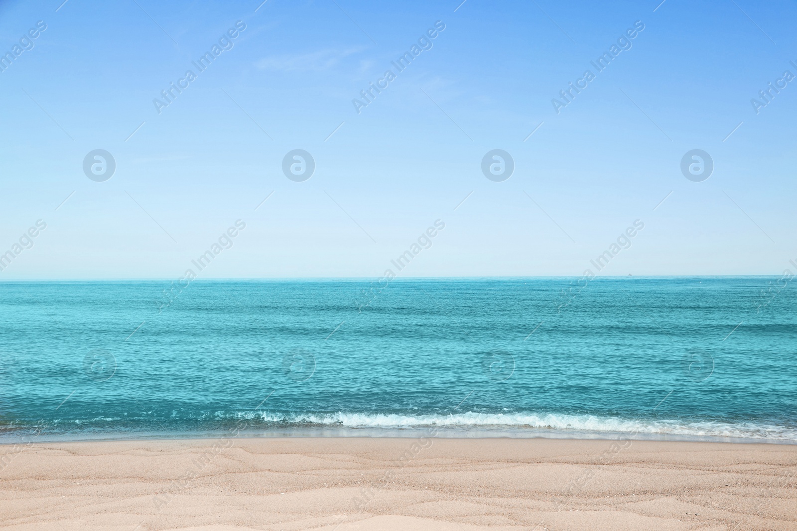 Photo of Picturesque view of sandy beach near sea