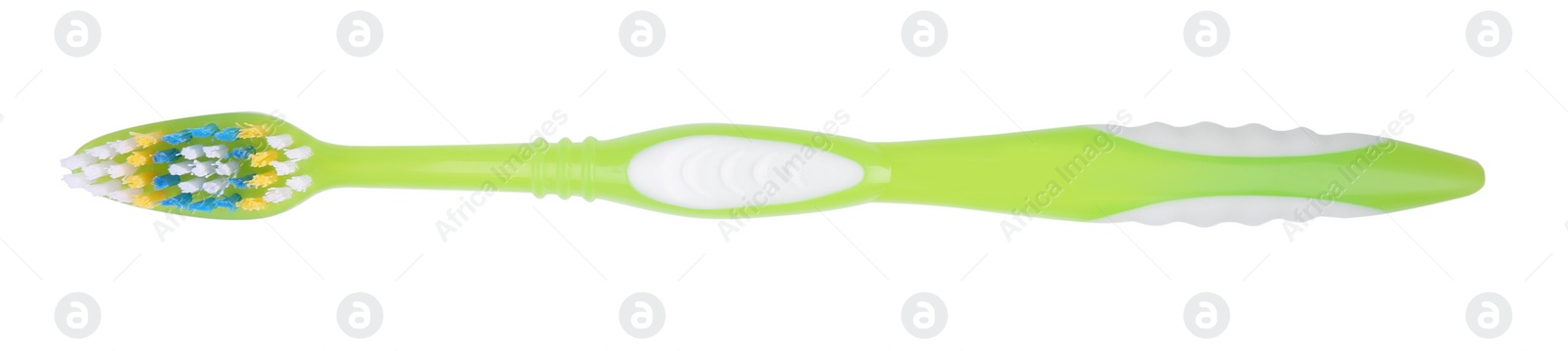 Photo of Light green plastic toothbrush isolated on white, top view
