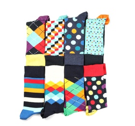 Photo of Colorful socks on white background, top view