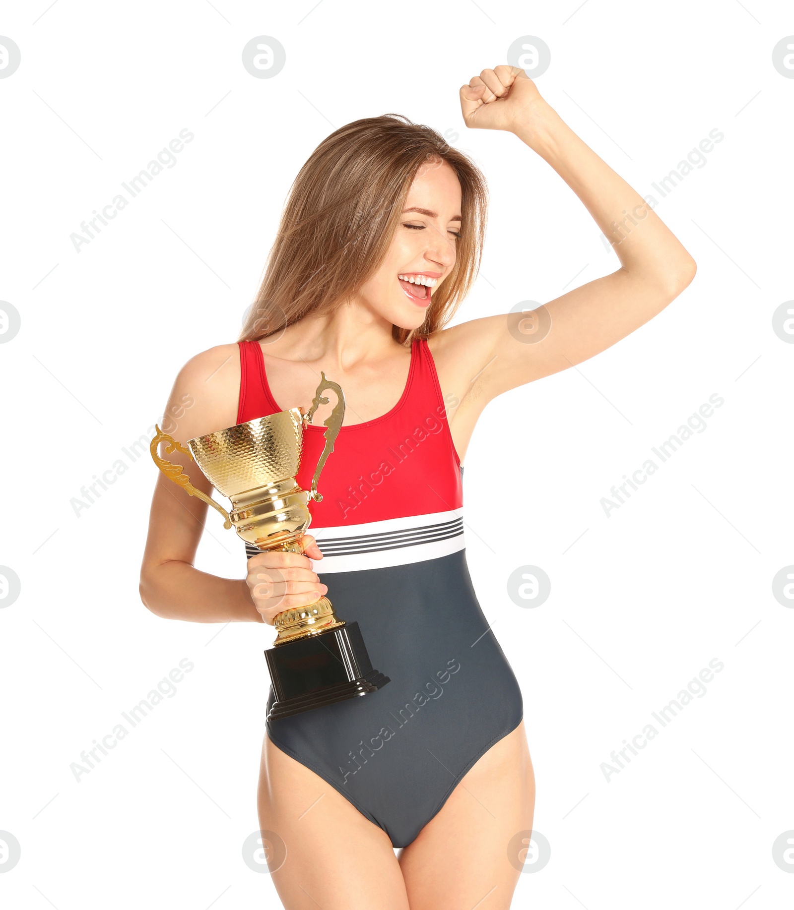 Photo of Happy young woman in swimwear holding golden cup on white background