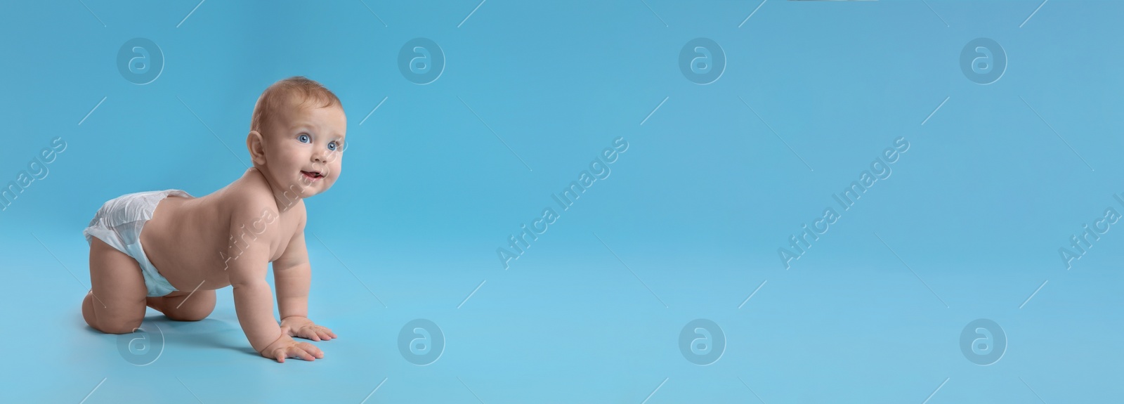 Image of Cute baby in diaper crawling on light blue background, space for text. Banner design