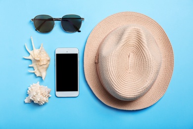 Flat lay composition with beach objects on color background