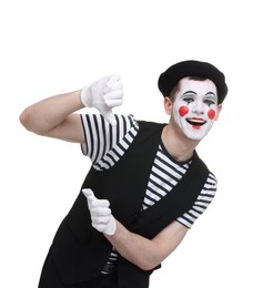 Photo of Funny mime artist in beret posing on white background