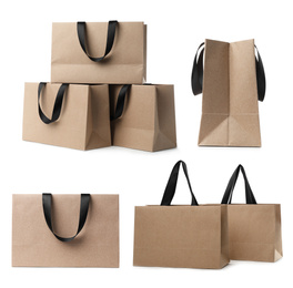 Set with kraft paper shopping bags on white background