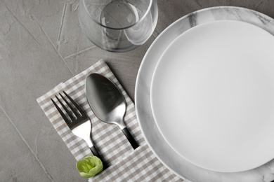 Beautiful table setting on grey background, flat lay