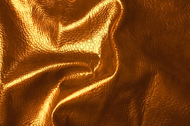 Image of Texture of crumpled golden leather as background, closeup