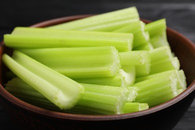 Photo of Fresh cut celery in bowl, closeup view