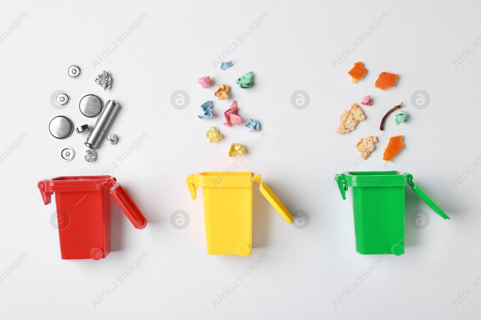 Photo of Trash bins and different garbage isolated on white, top view. Waste recycling concept