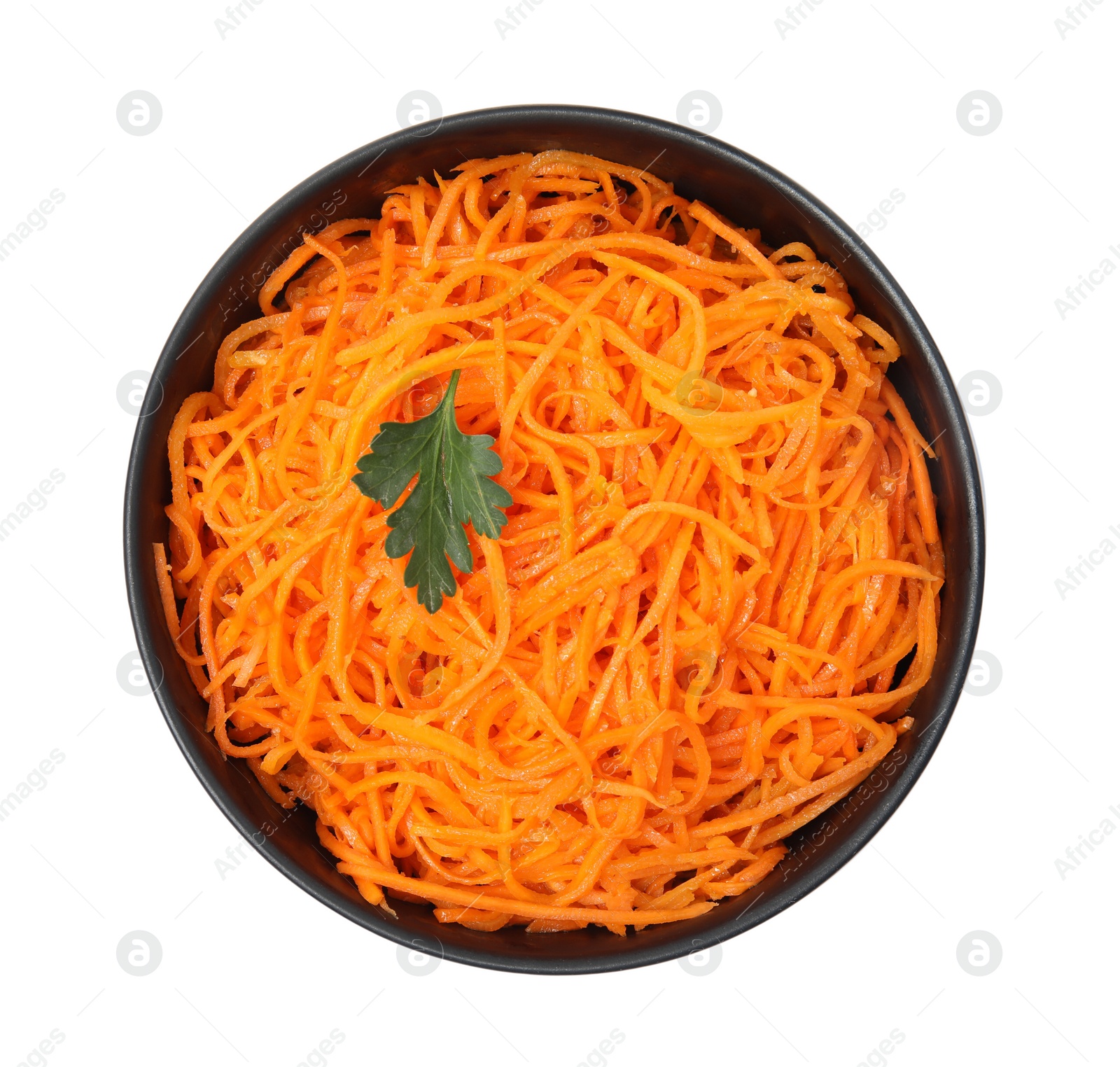 Photo of Delicious Korean carrot salad with parsley in bowl isolated on white, top view