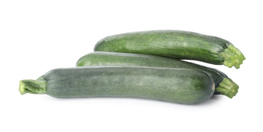 Photo of Raw green ripe zucchinis isolated on white