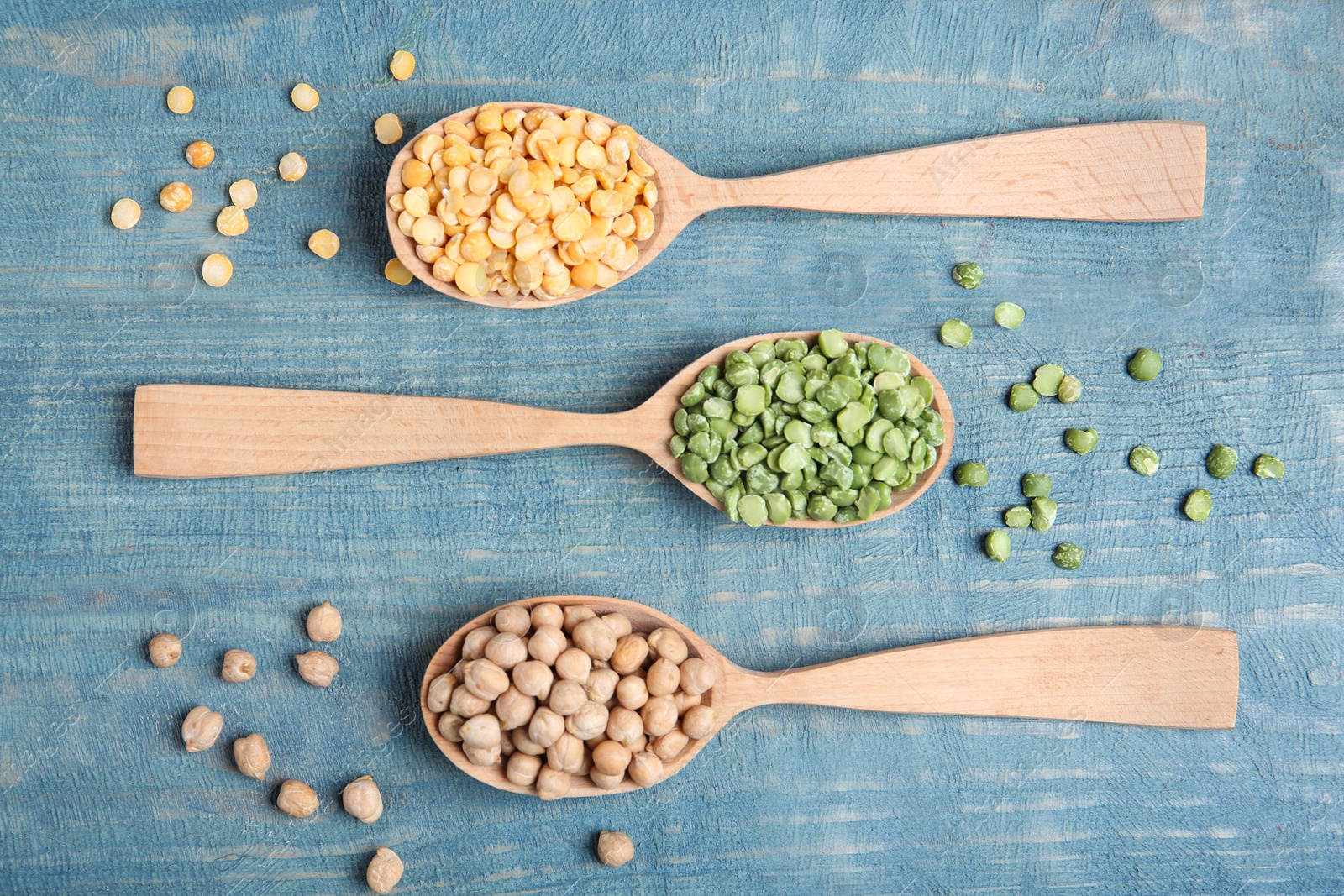 Photo of Flat lay composition with different dried peas on wooden background