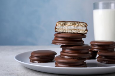 Photo of Stack of tasty choco pies on grey table