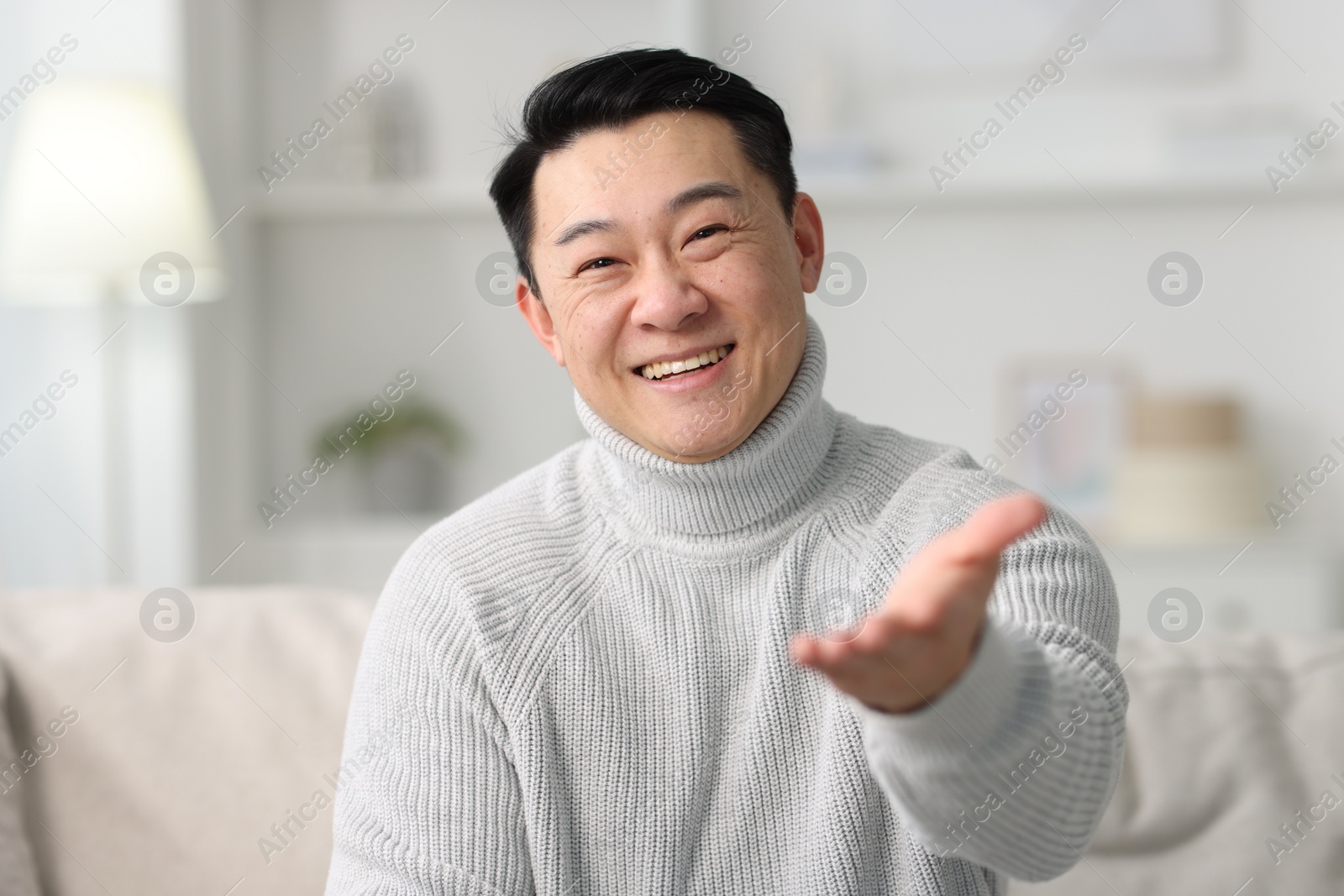 Photo of Portrait of smiling man on blurred background
